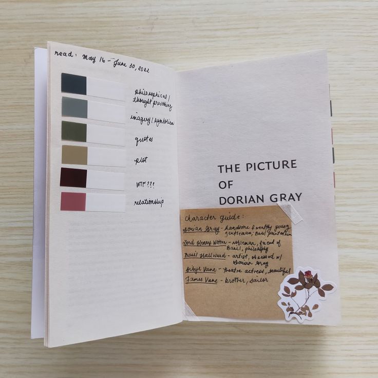 an open book with some type of writing on the page and color swatches in it