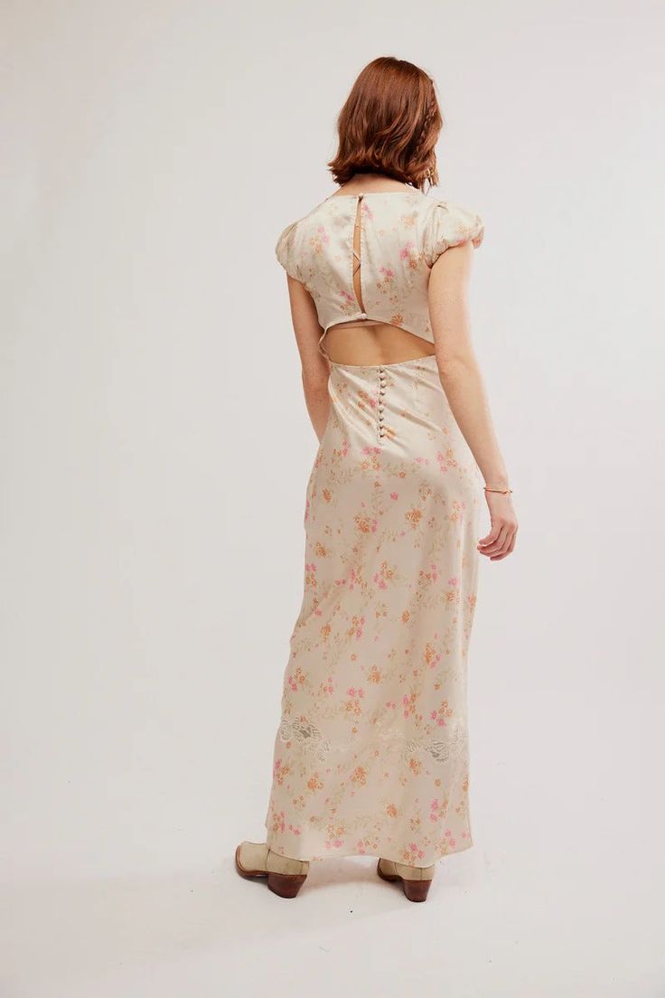 Embrace your inner butterfly with the Free People Butterfly Babe Maxi Dress! This stunning polka dot dress features a classic A-line silhouette and a beautiful butterfly lace neckline. With its exposed back detail and defined cap sleeves, it's perfect for any occasion. Let your style take flight with this timeless dress. 100% Polyester Embroidery: 100% Polyester Trim: 100% Nylon Spring Fitted Maxi Dress With Cutout Back, Spring Midi Dress With Keyhole Back, Fitted Maxi Dress With Cutout Back For Spring, Midi Length Spring Dress With Keyhole Back, Feminine Fitted Maxi Dress With Tie Back, Fitted Tie-back Feminine Maxi Dress, Fitted Midi Dress With Keyhole Back For Summer, Daywear Backless Dress With Lace Trim, Spring Brunch Dress With Keyhole Back