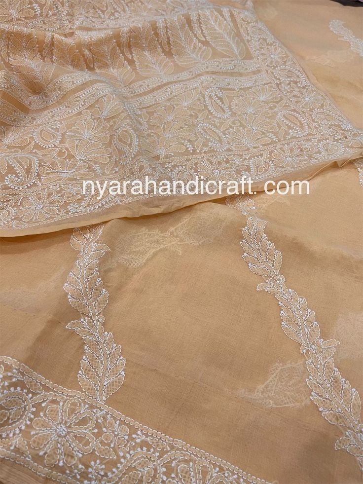 "Light peach cotton Chikankari Saree with all over \"chadi\" design and heavy palla. Beautiful Chikankari is a famous hand embroidery style from Lucknow, City of Nawabs, India! FALL ATTACHED AND PETTICOAT INCLUDED ! Includes an embroidered blouse piece too." Traditional Peach Dupatta With Intricate Embroidery, Traditional Wear With Intricate Embroidery In Peach, Peach Traditional Wear With Intricate Embroidery, Traditional Peach Wear With Intricate Embroidery, Unstitched Peach Traditional Wear With Cutdana, Peach Chanderi Traditional Wear With Cutdana, Traditional Peach Saree With Resham Embroidery, Traditional Peach Dupatta With Cutdana, Festive Peach Traditional Wear With Chikankari Embroidery