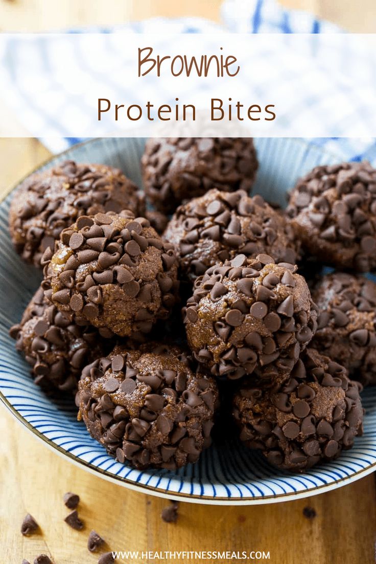 chocolate brownie protein bites on a blue and white plate