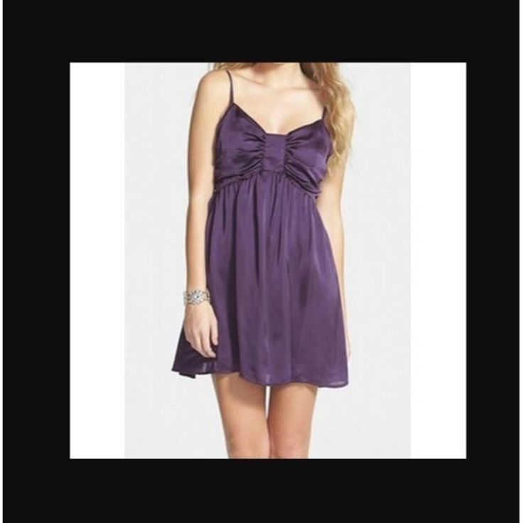 Love Fire Color: Purple. V-Neckline. Empire Waistband. Spaghetti Straps. A-Line. Side Zipper Closure. Measurements Are Taken On A Flat Surface As Accurately As Possible. Bust: Underarm To Underarm 15" Waist: 12 1/2" Length: Underarm To Hem 22 1/2" Shell: 100% Polyester. Lining: 100% Polyester. Care: Machine Wash. Condition: New With Tags. Purple Mini Dress For Summer Bridesmaid, Purple Mini Dress For Bridesmaid In Summer, Purple Bridesmaid Mini Dress, Deep Purple Dress, Beach Mini Dress, Love Fire, Lace Overlay Dress, Bow Detail Dress, Short Sleeve Mini Dress