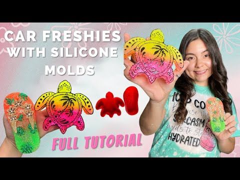 a girl is holding up some colorful plastic molds with the words car freshies with silcone molds