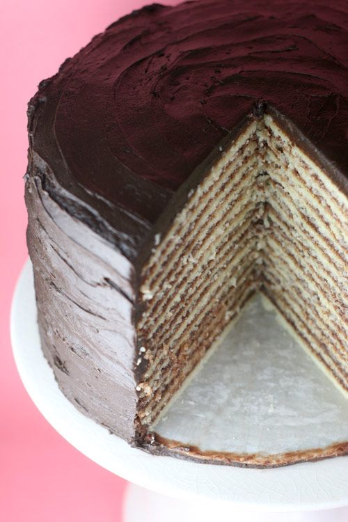 a chocolate layer cake with one slice cut out