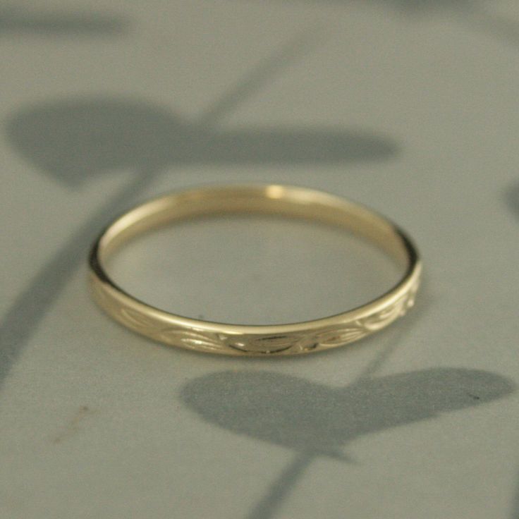 Rings for Women 10K Wedding Ring Sweet Pea Leaf Design Ring Patterned Band 10K Gold Ring Women's Wedding Ring Vintage Style Ring Women Hand cast in our studio from solid 10K gold, this is such a pretty little ring! Perfect for stacking or as a romantic vintage style wedding band. The ring features a small dot and leaf pattern that swirls around the band. It measures 2mm wide by 1mm thick and features a flat profile. It will be hand made to size just for you and meticulously polished to a high sh Yellow Gold Engraved Stackable Wedding Rings, 14k Gold Stackable Rings With Decorative Band For Wedding, Engraved Yellow Gold Stackable Rings For Wedding, Engraved Yellow Gold Stackable Wedding Rings, Wedding Stackable Yellow Gold Rings With Diamond Cut, Wedding Fine Jewelry Stackable Rings Stamped 14k, Wedding Stackable Rings In Diamond-cut Yellow Gold, Yellow Gold Diamond Cut Stackable Rings For Wedding, Wedding Stackable Rings Stamped 14k Fine Jewelry