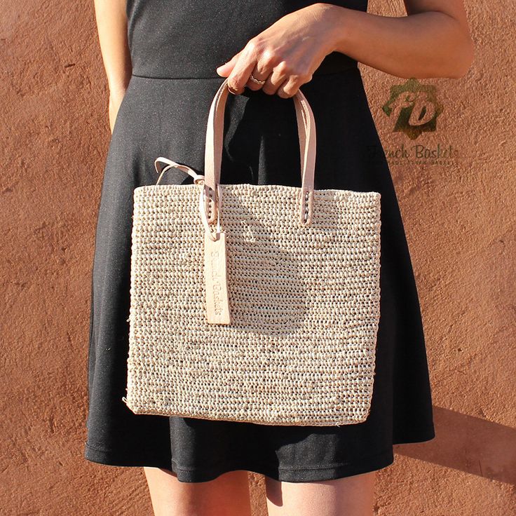 "Medium Tote bag made of Raffia Natural Yarn straw Natural color SIZE Basket: H26cm x L27cm / H10 in x L10,5 in Handles 40 cm / 15 in Our Baskets are classic French Market Basket. The perfect choice for shopping trips, picnics, days at the beach. Not only, they're eco-friendly, they look great in the home for storing toys or magazines. Handwoven by women in Morocco using palm leaf, and crafted in our workshop, they are both sturdy and flexible. With short leather handles for comfortable carrying Beige Rectangular Straw Bag For Travel, Casual Crochet Bag With Woven Leather In Natural Color, Beige Rectangular Straw Bag, Eco-friendly Crochet Bag With Woven Leather, Spring Beach Bag In Natural Woven Leather, Travel Woven Paper Straw Bags, Beige Crochet Bag With Woven Leather, Woven Paper Straw Travel Bags, Spring Natural Woven Leather Beach Bag