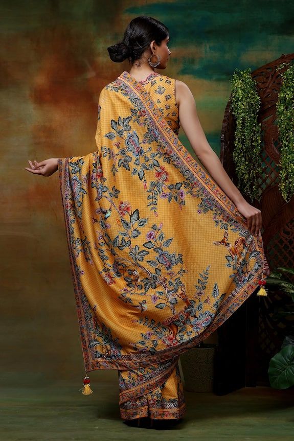 Yellow saree featuring sequin embroidered, deer, tree printed saree with shell tassels. Paired with a  printed scallop blouse. - Aza Fashions Festive Silk Pre-draped Saree With Printed Motifs, Traditional Pre-draped Saree For Reception With Printed Motifs, Bollywood Style Choli With Printed Motifs, Bollywood Style Pre-draped Saree With Printed Motifs For Reception, Bollywood Style Blouse Piece With Printed Motifs For Reception, Reception Sharara Saree With Printed Motifs, Reception Sharara With Printed Motifs, Wedding Semi-stitched Pre-draped Saree With Printed Motifs, Transitional Pre-draped Saree With Printed Motifs