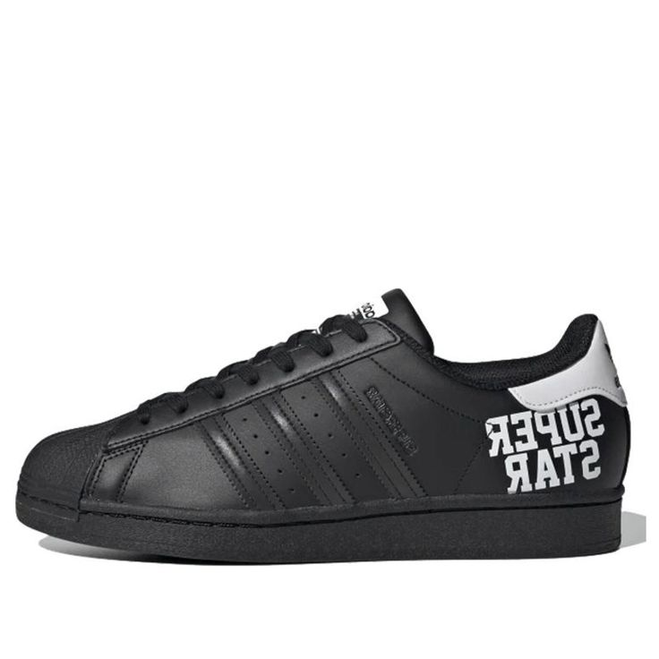 adidas Superstar 'Varsity Pack - Core Black' Core Black/Core Black/Cloud White Sneakers/Shoes Adidas Sneakers With Logo Print For Sports, Urban Style Sports Sneakers With Letter Print, Black Adidas Superstar, Superstars Black Shoes, Black And White Superstars, Black Adidas Shoes Superstar, Black Clouds, Black Core, White Shoes Sneakers