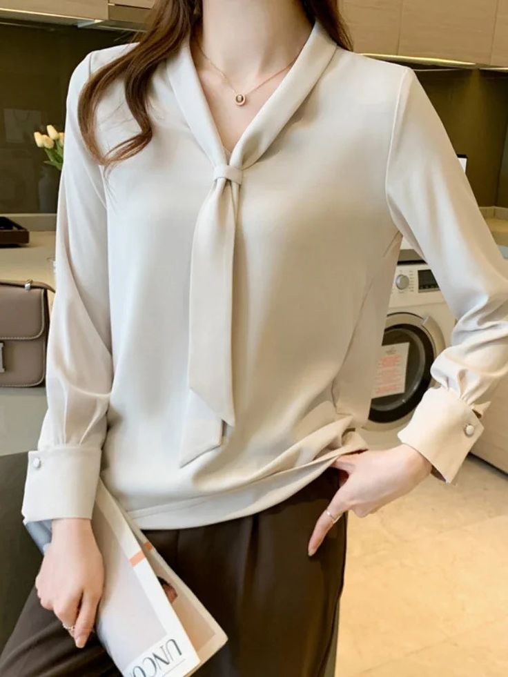 Size Chart S: Bust 82cm, Length 62cm, Shoulder 38cm, Sleeve 57cm M: Bust 86cm, Length 63cm, Shoulder 39cm, Sleeve 58cm L: Bust 90cm, Length 64cm, Shoulder 40cm, Sleeve 59cm XL: Bust 94cm, Length 65cm, Shoulder 41cm, Sleeve 60cm NOTE: 1. There is 2-3 cm different according to manual measurement. 2. Please check the size chart carefully before order the item. 3. Please note that slight color difference should be acceptable due to the light and screen. Model Show window.adminAccountId=2671802296; Fall Tie Neck Tops For Office Wear, Fall Office Wear Tie Neck Tops, Casual Tie Neck Blouse For Office, Beige Long Sleeve Office Blouse, Casual Office Blouse With Tie Neck, Solid Color Tie Neck Tops For Fall, Solid Tie Neck Tops For Fall, Beige Collared Top For Office, Beige V-neck Tops For Formal Occasions