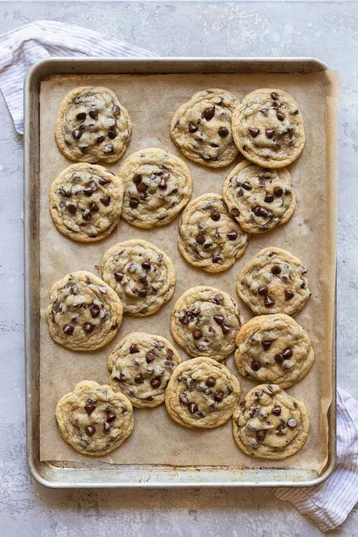 chocolate chip cookies on a cookie sheet ready to be baked in the oven for christmas