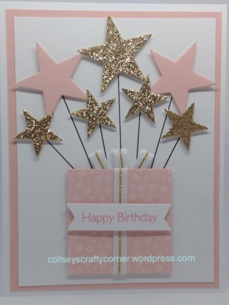 a birthday card with gold stars and a pink gift box on it's side