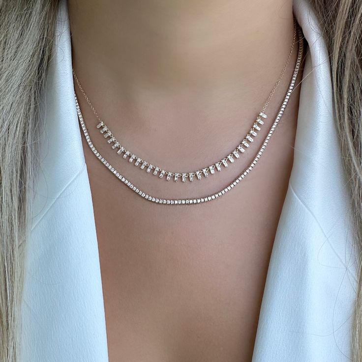 The mini version of our popular 14K gold tribal baguette drop diamond necklace. It offers an eye-catching look that will elevate any outfit. Handcrafted to ensure exceptional quality, this necklace features a unique combination of baguette and round diamonds, set in a tribal design that will add character and sparkle to any look. The luminous baguette diamonds capture the light beautifully, making it an elegant piece that is sure to become a timeless keepsake. Item Information Metal: 14k Gold We Luxury Elegant Jewelry With Baguette Diamonds, Luxury Evening Jewelry With Baguette Diamonds, Luxury Baguette Cut Single Diamond Necklace, Luxury Baguette Diamond Wedding Necklaces, Luxury Minimalist Jewelry With Baguette Diamonds, Luxury Diamond Necklace With Baguette Diamonds, Luxury Delicate Baguette Cut Jewelry, Luxury White Gold Solitaire Necklace With Baguette Cut, Luxury Baguette Diamond Fine Jewelry Necklace