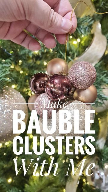 someone is hanging ornaments from the christmas tree with their hand and saying, it's bauble clusters with me