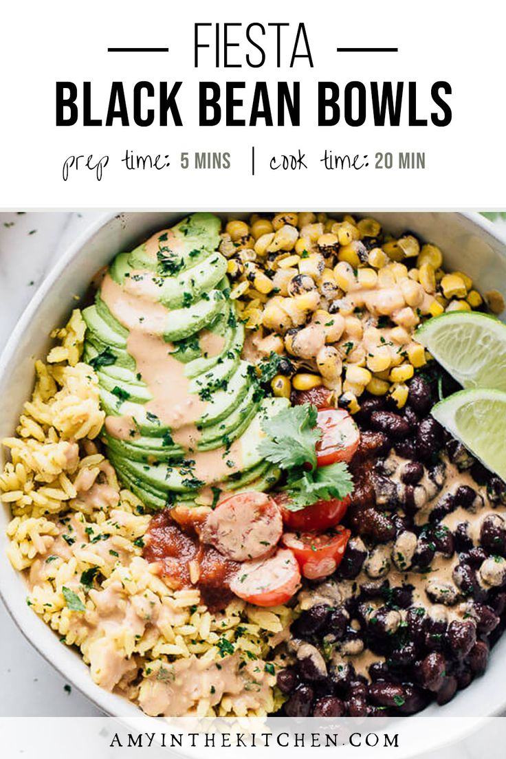 black bean bowls with avocado, tomatoes, corn and cilantro in a white bowl