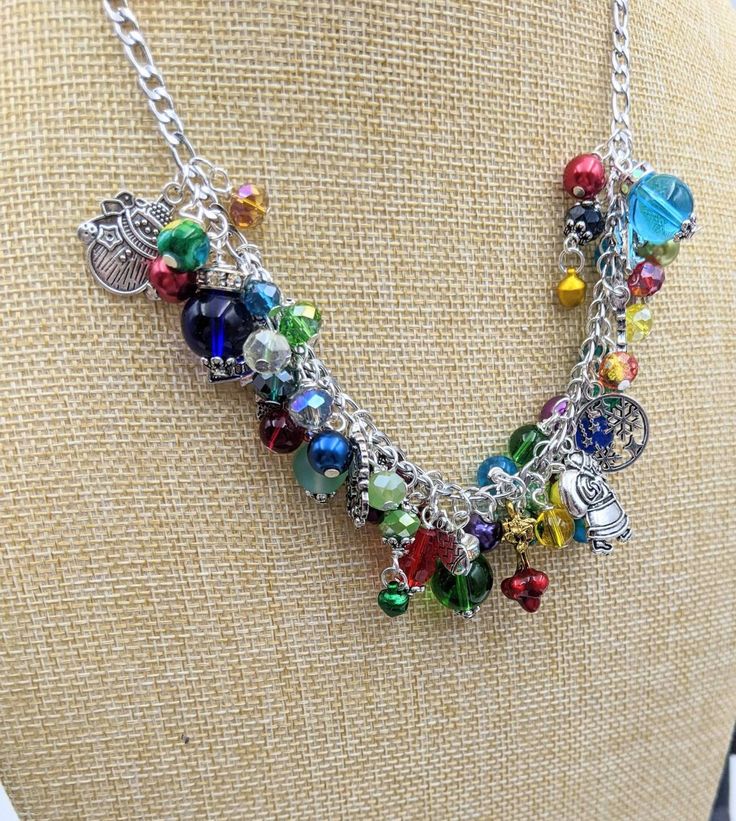 "Old Fashioned Christmas Charm Necklace Search my shop for \"Christmas\" to find matching bracelet and earrings. Chain is 18\" long with a 3\" extension chain.  It has a lobster claw closure. The stainless steel chain links are filled with a rainbow of glass and gem stone beads and crystals - really pretty. Mixed between the beads and gemstones are vintage Christmas themed charms and tiny jingle bells. This makes a great gift or the perfect holiday accessory for yourself! Your necklace will be c Nickel-free Rainbow Jewelry For Party, Adjustable Multicolor Nickel-free Charm Necklaces, Adjustable Multicolor Charm Necklaces Nickel Free, Whimsical Multicolor Jewelry With Charms, Whimsical Multicolor Charms Jewelry, Adjustable Multicolor Christmas Jewelry, Whimsical Multicolor Personalized Jewelry, Adjustable Rainbow Jewelry With Lobster Clasp, Colorful Adjustable Chain Jewelry Gift