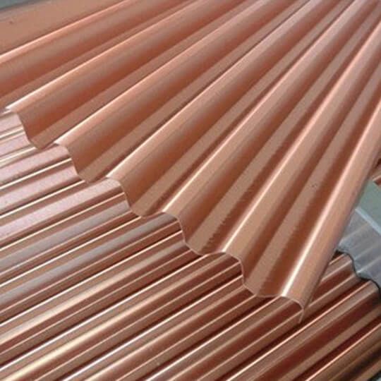 copper colored metal roofing sheets are stacked on top of each other