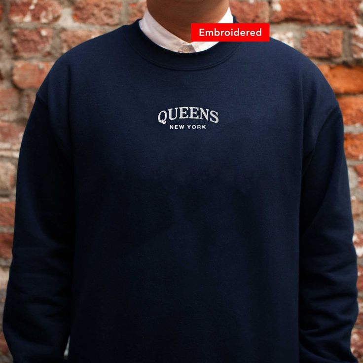 "*SIZES ARE UNISEX* -I'd suggest your usual size for a regular fit, or sizing up for a more relaxed fit. *these sweatshirts are extra comfy when oversized \"Queens New York\" embroidered on a comfy cute crewneck. A sturdy and warm sweatshirt bound to keep you warm in the colder months. A pre-shrunk, classic fit sweater that's made with air-jet spun yarn for a soft feel and reduced pilling. Your new favorite sweatshirt! * 50% cotton, 50% polyester * Pre-shrunk * Classic fit with no center crease Crew Neck T-shirt With Letter Embroidery For College, Varsity T-shirt With Embroidered Graphics For Fall, Relaxed Fit Crew Sweater With Embroidered Logo, Relaxed Fit Crew Top With Embroidered Logo, Varsity Tops With Embroidered Graphics And Relaxed Fit, College Crew Neck Sweats With Embroidered Logo, College Crew Sweatshirt With Embroidered Logo, Crew Neck Hoodie With Embroidered Logo For College, Varsity Sweatshirt With Letter Embroidery For College