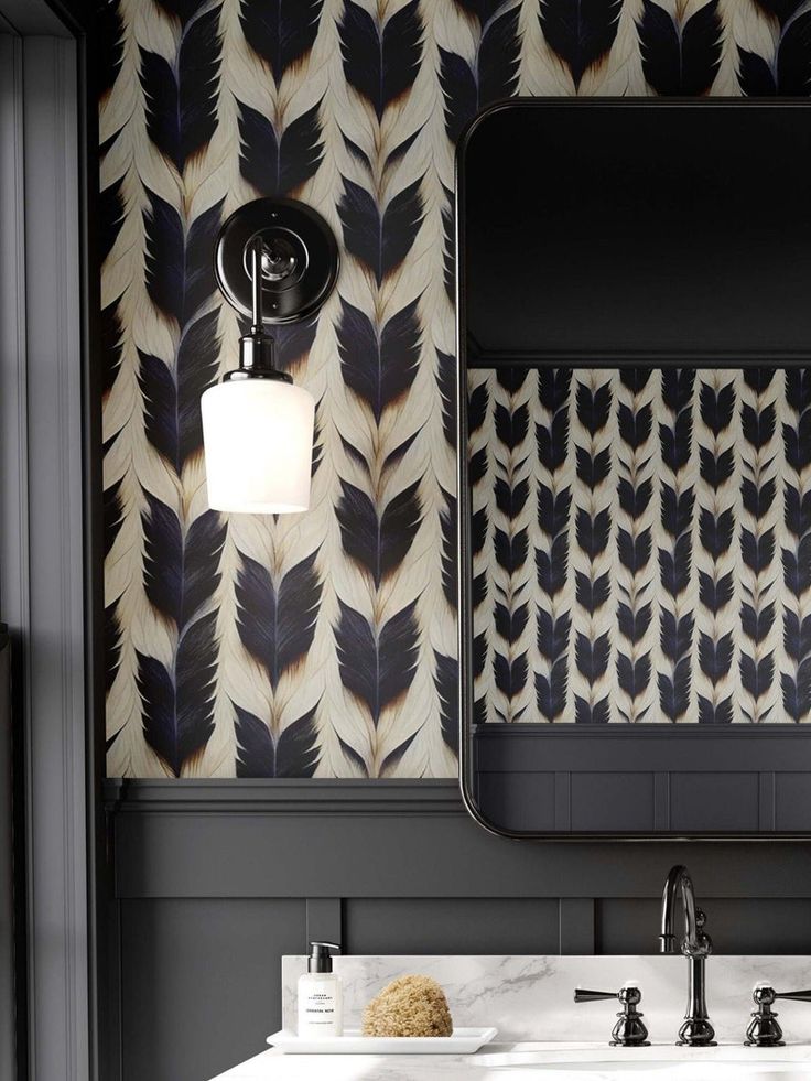 a bathroom vanity with two sinks and a large mirror above it, in front of a patterned wallpaper