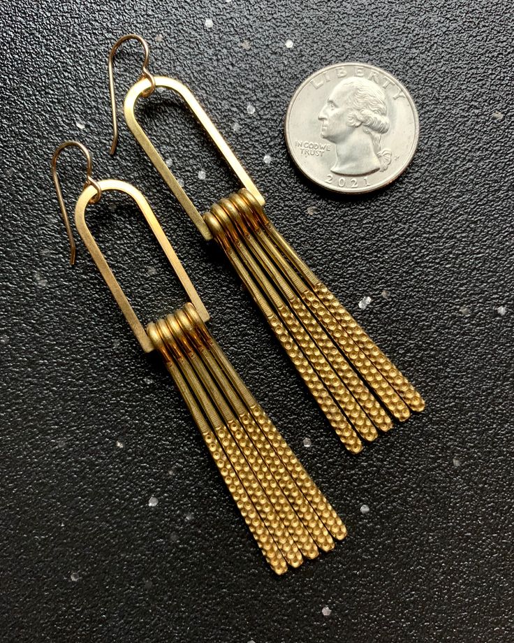 These dangle earrings are an original design by the shop owner Jordana, handmade by her here in Asheville and exclusive to ELEMENTALITY! (HUSH)FEATURES: high quality 14KGF ear wires 3.25" long from top of ear wire to bottom of dangle medium weight brass fringe & components handmade in Asheville, NC, USA THE METALS: • GOLD- sun energy • energy • boundaries • abundance • BRASS- mars energy• healing • courage • abundance THE MAKER: Jordana is the creator/owner of Elementality and, like our shop, li Gold Chandelier Dangle Earrings For Everyday, Gold Long Drop Chandelier Earrings Nickel Free, Gold Nickel-free Long Drop Chandelier Earrings, Gold Dangle Chandelier Earrings With French Hook, Adjustable Gold Dangle Linear Earrings, Yellow Gold Brass Dangle Chandelier Earrings, Yellow Gold Brass Chandelier Dangle Earrings, Handmade Gold Linear Earrings For Everyday, Gold Long Drop Linear Earrings Nickel Free