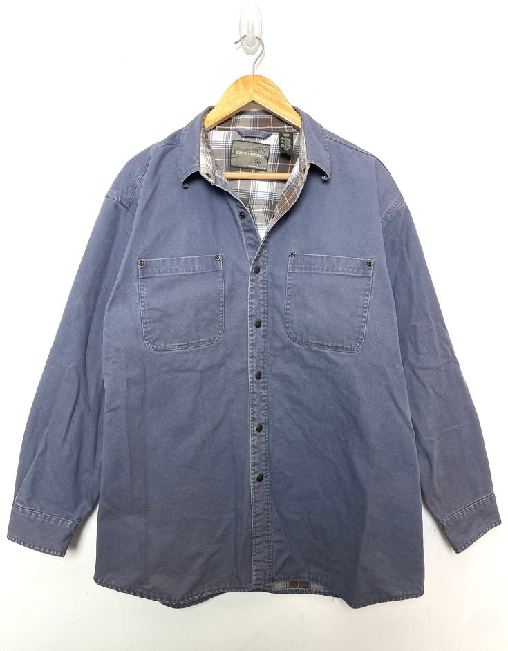 This shirt has small marks on the lower front + back sides and on the right sleeve. (please see photos for flaws) Measurements pit to pit: 24 inches  Top to bottom: 31 inches Button Up Long Sleeve, Cargo Pocket, Mens Oxfords, Plaid Flannel, Long Sleeve Shirt, Sleeve Shirt, Work Wear, Button Up, Long Sleeve Shirts