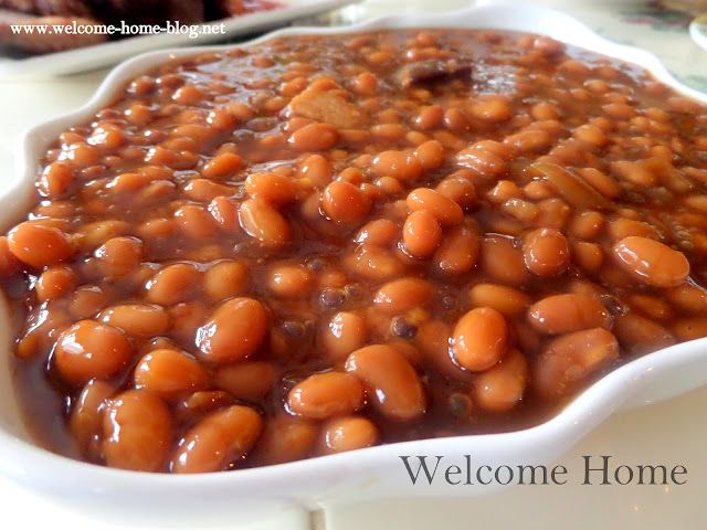 baked beans in a white dish on a table