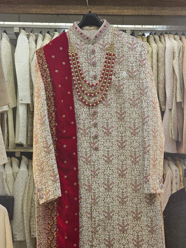 Handcrafted Designer Sherwani for groom made from the finest fabric will make you feel like a king on the happiest & most important day of your life. you can customize it according to your measurement as the fitting make it more beautiful to wear. The package includes the Sherwani, Churidar pants (which are styled without any specific design)  We can also give you a turban, jooti, mojari, jewellery of your matching outfit (additional cost will be apply). For your comfort and best fit we keep 2 Inches Extra Margin in the dress, please provide with exact measurements. All Patterns Are Intricately Embellished With Thread Work. Pagri For Men, Festive Kurta With Cutdana For Reception, Reception Kurta With Cutdana For Festivals, Festive Cutdana Kurta For Receptions, Bandhgala With Dabka For Diwali Reception, Dabka Bandhgala For Diwali Reception, Churidar With Dabka Work And Traditional Drape For Reception, Traditional Drape Churidar With Dabka For Reception, Reception Churidar With Dabka In Traditional Drape