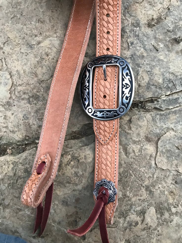 "Hand made 1.5\" wide headstall with buckle. These headstalls are made in our shop and are made to order. Buckles may vary as inventory changes and new styles are released. They are made from Heavy 14/16 ounce Herman Oak leather. Embossed with the Western Floral, Basketweave, Plain, and soon barbwire. Jermiah Watt Hardware is used and is top quality stainless steel hardware. These headstall get compliments wherever you go and a great using piece of tack." Basket Weaving, Emboss, Farm Animals, Makeup Bag, Leather Bracelet, Hand Made, Cowboy, Buckle, Stainless Steel