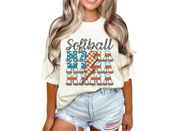 Celebrate your softball mom pride with our patriotic softball mama shirt, featuring red, white, and blue American flag letters and a retro checkered lightning bolt down the middle. With short sleeves and a crewneck design, this tee is the perfect gift for any mom who loves softball, perfect for cheering on your favorite player at the ballpark or celebrating the Fourth of July in true American baseball style. COMFORT COLORS 1717 SHIRT: Unisex 100% US cotton - ethically grown and harvested Pre-Shr White Casual T-shirt For Cheerleading, Casual T-shirt For Cheerleading During Baseball Season, Sporty White Tops With American Flag Print, Softball Mama, Blue American Flag, Mom Pride, T Ball, Mama Tshirts, True American