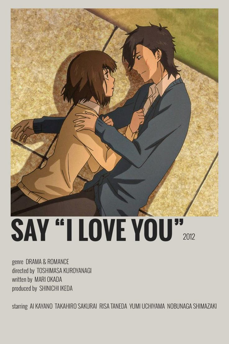 two people sitting on the ground in front of a poster that says say i love you