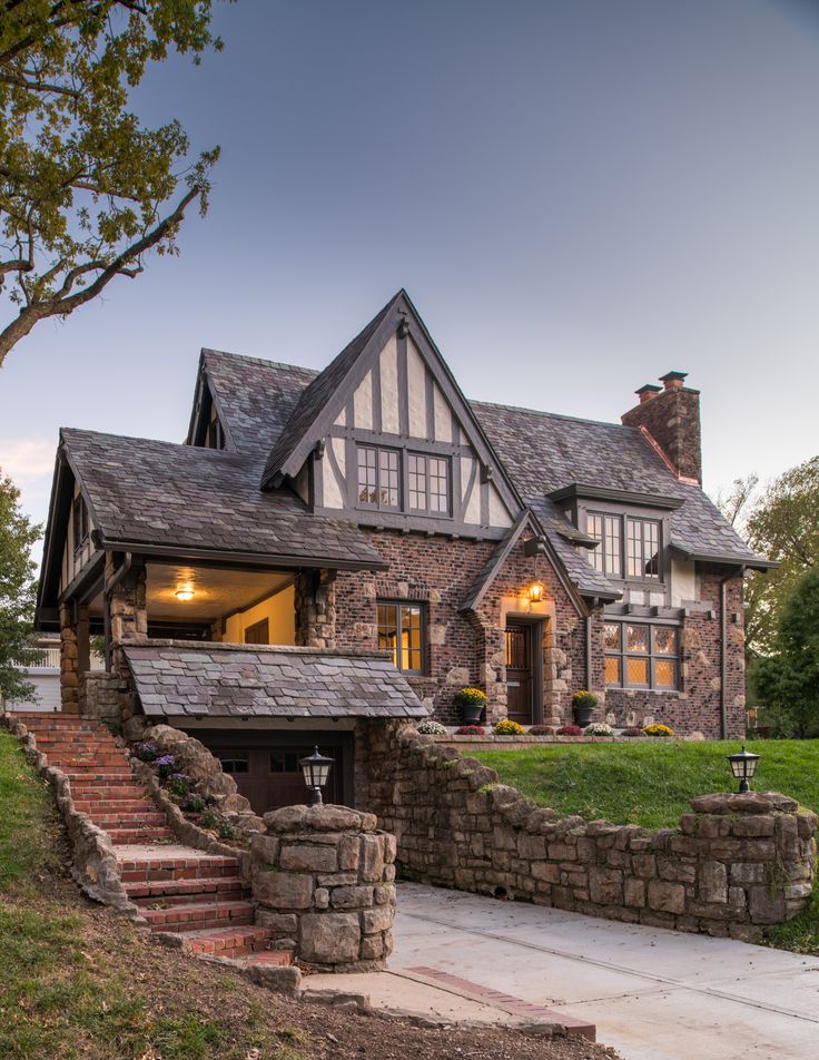 a large house with stone steps leading up to it