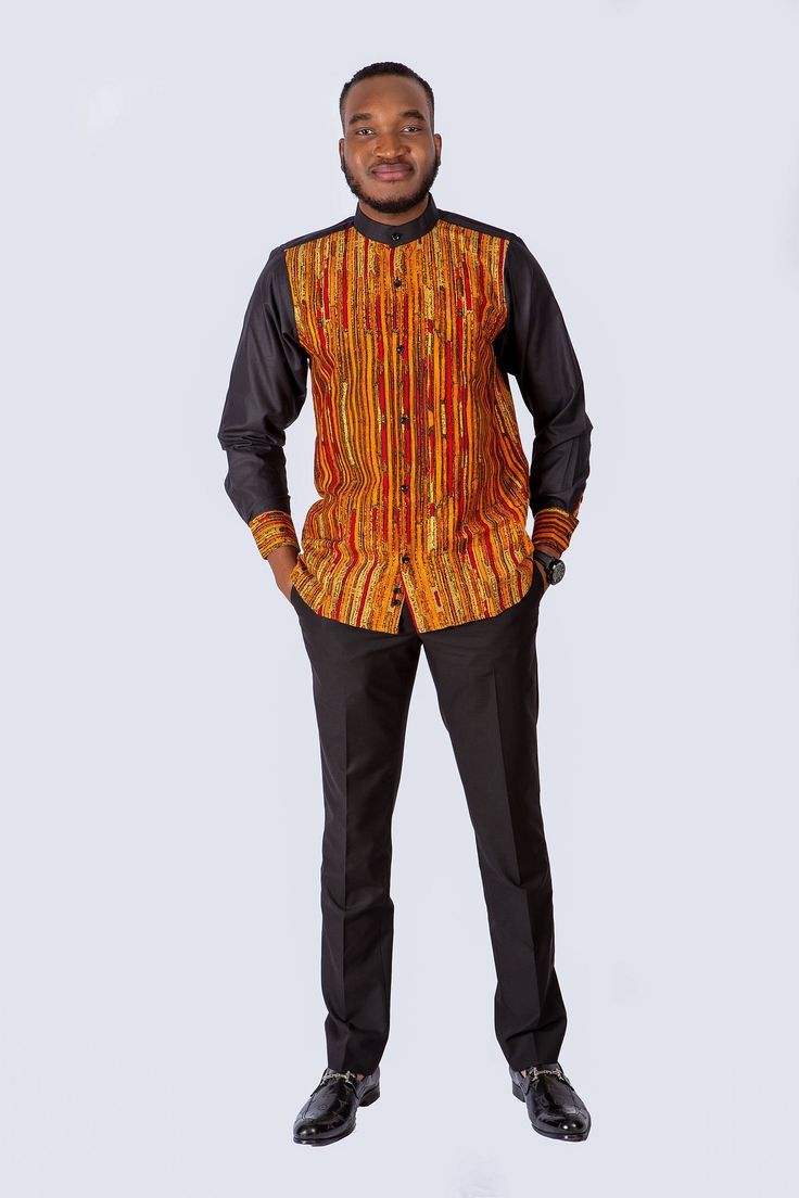 Add an elegant touch to your wardrobe with this Tata embellished long sleeve shirt. The solid sleeves contrast nicely with the colorful body, while the half collar adds a whole new dimension of elegance to this piece. Description *100% Cotton African Print Wax  *Long solid black sleeves *Front button *Side slits *Half collar *Top length is 24 inches  *Made in Cameroon *Fabric from Benin  Care instructions. *hand wash cold. *iron on wrong side. *hang to dry. *do not bleach. African Print Shirt, African Shirts For Men, Black Sleeves, African Shirts, Mens T Shirts, Collar Top, African Attire, African Print, African Fashion