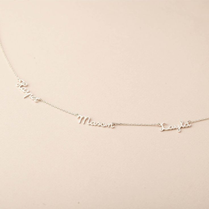 "♥ Mom Necklace With Kids' Name ♥ Meticulously crafted by hand with an elegant and fashionable appearance, this names necklace makes a perfect gift for your beloved mom. Customize it with the names of your choice to make it unique. P R O D U C T ∙ I N F O * Material: High Quality Solid 925 Sterling Silver * Finishing: Silver, Gold or Rose Gold. * Word limits: up to 12 characters per name for best visibility. * All of our jewelry are handmade from scratch and packaged with care in our workshop H Dainty Name Necklace For Mom, Elegant White Name Necklaces, Elegant Sterling Silver Charm Necklace With Names, Elegant Sterling Silver Personalized Charm Necklace, Sterling Silver Name Necklaces For Gifts, Dainty Silver Necklace With Names, Silver Dainty Necklace With Names, Adjustable Sterling Silver Necklace With Names, Elegant Sterling Silver Name Charm Necklace