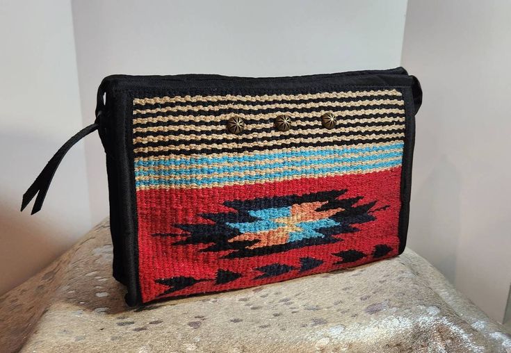 "This is a beautiful bag with vibrent colors and a top zipper closure that is lined with an interior zipper pocket. It is a mediam size bag with lots of room for all of your essentials. It would be great for any trip or overnight stay.  This case is made out of an Acrylic woven weave and comes in multiple colors. 10\" x 7\" x 3.5\" Please feel free to message me if you have any questions!  SHIPPING Most orders are able to ship within 72 hours. I ship through USPS 1st Class mail. Estimated time o Southwestern Crossbody Bag For Everyday Use, Southwestern Style Crossbody Bag For Everyday Use, Multicolor Shoulder Bag With Zipper For Travel, Multicolor Southwestern Bags For Everyday Use, Southwestern Multicolor Bags For Everyday Use, Multicolor Southwestern Everyday Bags, Multicolor Southwestern Style Everyday Bags, Southwestern Multicolor Everyday Bags, Bohemian Travel Bags With Zipper Pouch