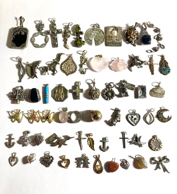 Big sale on antique to vintage sterling silver pendant & charms, along with some gold filled charms. Message me if you need sizes or weights. Pendants are each sold separately & have corresponding numbers. Pendant/charms are listed left to right in rows of ten going downwards. Last picture is of the back of all the pendants.  First row: 1. black onyx Pendant in rhodium plated. 2. Art deco Antique rhodium plated & clear paste Pendant. 3. Sterling silver Vintage heart cross. 4. Art deco platinum p Heirloom Jewelry With Round Pendant Charms, Heirloom Round Pendant Jewelry With Charms, Collectible Round Pendant Charms Jewelry, Vintage Pendant Charm Necklace With Dangling Charms, Vintage Charm Necklace With Dangling Pendants, Vintage Charm Necklaces With Dangling Charms For Jewelry Making, Vintage Charm Necklace With Dangling Charms For Jewelry Making, Vintage Metal Charm Necklace, Anniversary Pendant Charms With Dangling Details