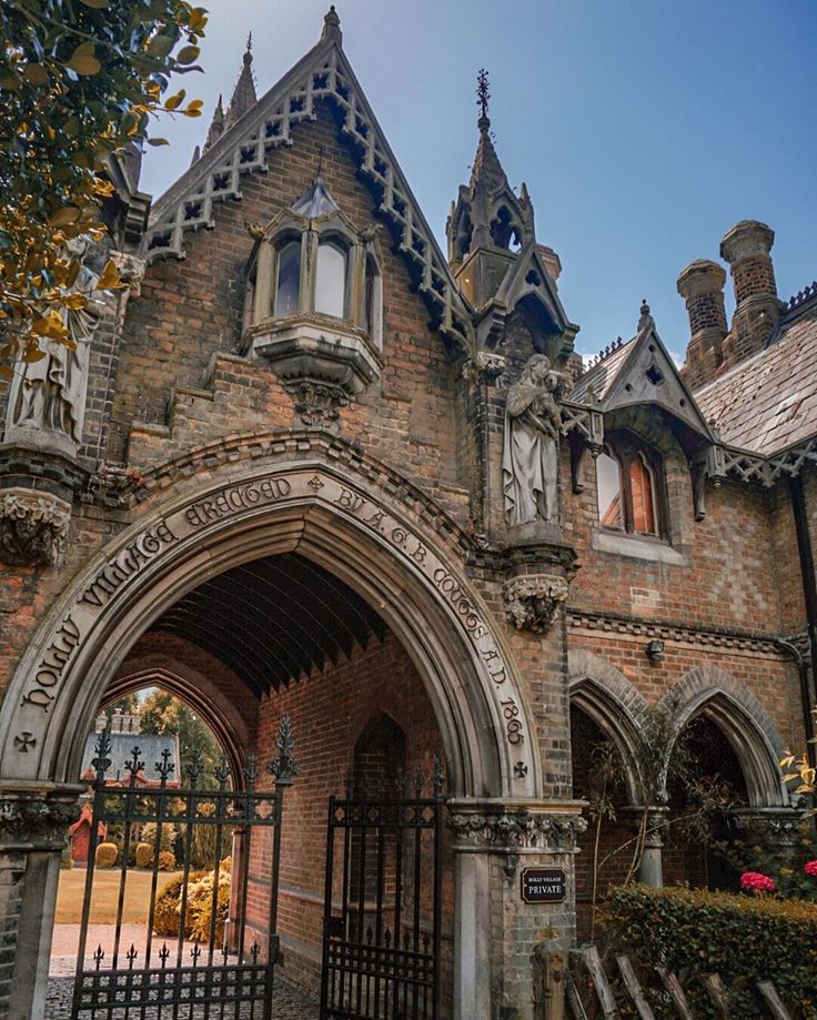 an old building with a gate in front of it