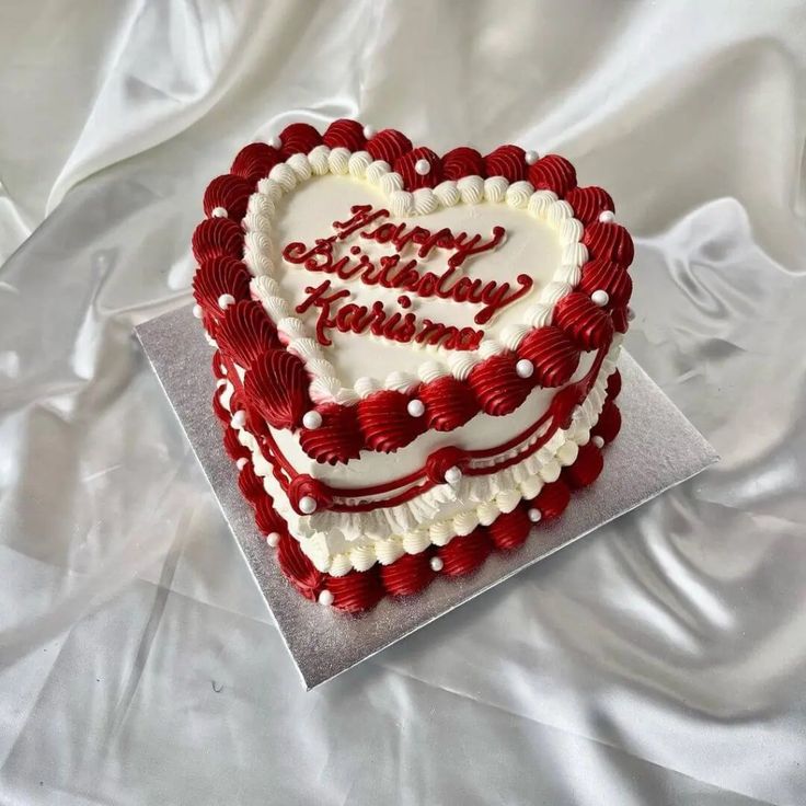 a heart - shaped cake with the words happy birthday written on it