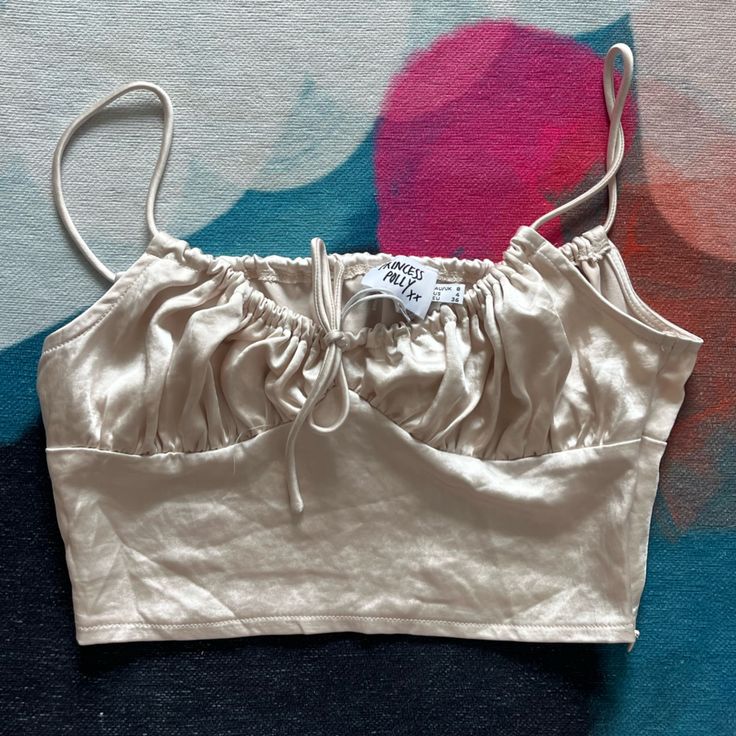 Brand: Princess Polly Color: Gold Size: Us 4 Condition: New With Tags Elegant Silver Crop Top For Summer, Princess Polly, Crop Top, Size 4, Womens Tops, Crop Tops, Tags, Silver, Women Shopping