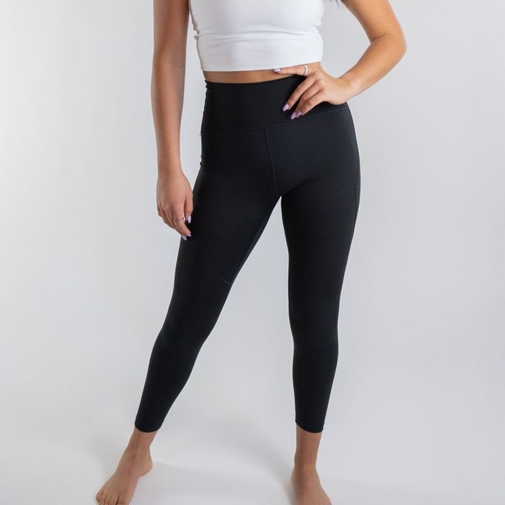 Elevate your workout wardrobe with our Trainer Muscle Tone Legging. Engineered to deliver the perfect blend of style, support, and performance, these leggings are designed for those who take their training seriously. The sculpting seam details are strategically placed to define and accentuate your leg muscles, giving you that toned, confident look. With a high-waist design and slimming waistband, these leggings offer excellent compression to keep everything in place, allowing you to move with co Compressive Sweat-resistant Leggings For Sports, Compressive Go-dry Tights For Gym, Athleisure Micro-elastic Tights For Training, Compressive Sports Leggings With Light Support, Compressive Leggings With Light Support For Sports, Compression Full-length Activewear For Workout, Compressive Full-length Activewear For Gym, Compression Workout Leggings, Sweat Resistant, Full-length Compression Activewear For Workout