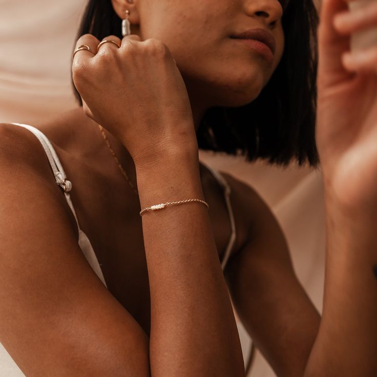 Subtle and oh-so-sweet, our Ariel Tiny Pearl Bracelet is one of those easy-to-wear pieces that adds a touch of elegance to any look. An effortless beauty, you'll never want to to be without these dainty pearls. Crafted with love in our sunny Brisbane studio, each KBN piece is made and assembled by our small team. As we create our jewellery by hand, there will always be variation in each piece. The beauty of this process is that each KBN piece is unique to its wearer. Dainty Resizable Chain Bracelet For Everyday, 14k Rose Gold Jewelry For Friendship, Dainty Resizable Chain Bracelet, Rose Gold 14k Friendship Jewelry, Friendship 14k Rose Gold Jewelry, Delicate Adjustable Everyday Charm Bracelet, Delicate Adjustable Charm Bracelet For Everyday, Adjustable Delicate Charm Bracelet, Adjustable Delicate 14k Gold-filled Bracelets