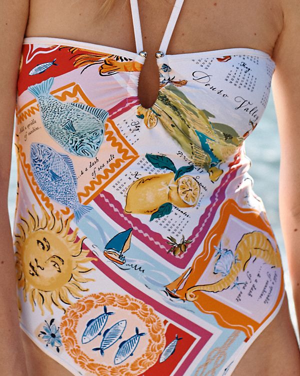 It's always a vacation in this fun swimsuit. Made of a recycled-nylon blend, with a modern placed print, contrast binding, and bandeau styling featuring a chic metal-ring detail in front and wear-or-not spaghetti straps.  By Seafolly. Removable tie-back straps. Gripper tape for secure coverage. Removable cups. High back. Tropical Swimsuit Aesthetic, Beach Elements Illustration, Cool Bathing Suits, Aesthetic One Piece Swimsuit, European Swimwear, Swimsuit 2024, Fun Swimsuit, Printed Swimwear, Pattern Swimsuit