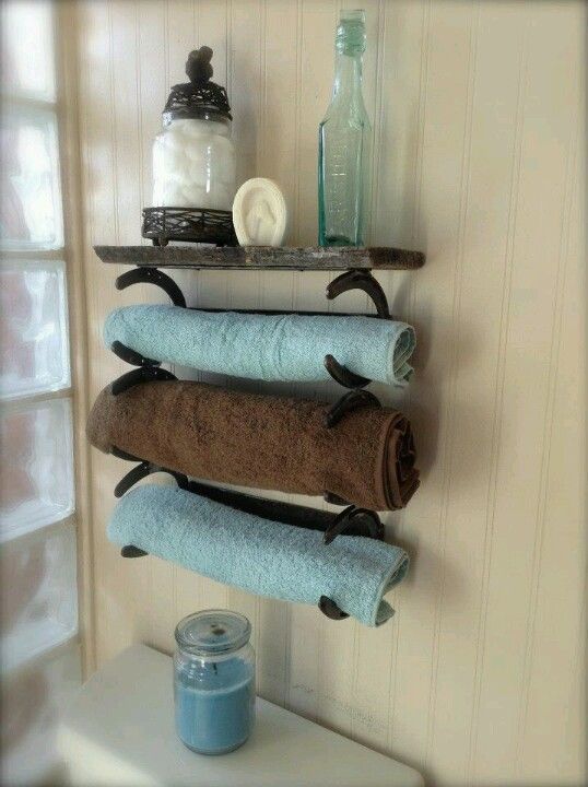 three towels are hanging on a towel rack