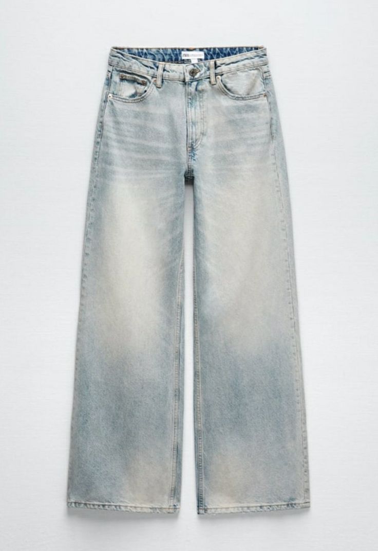 a pair of light blue jeans on a white background