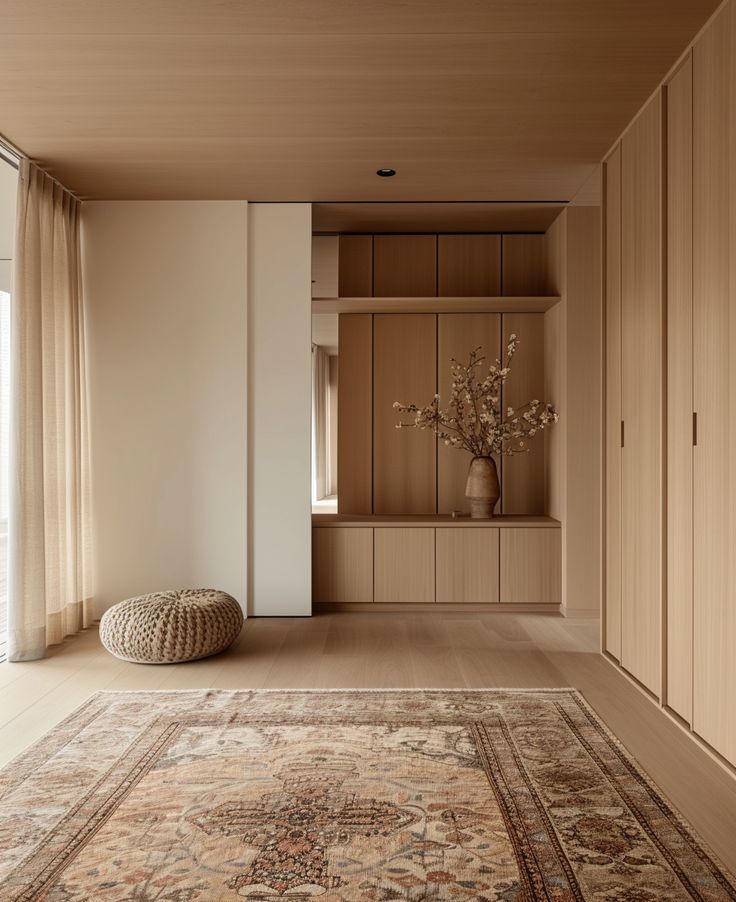 a large rug is in the middle of a room with wooden walls and flooring