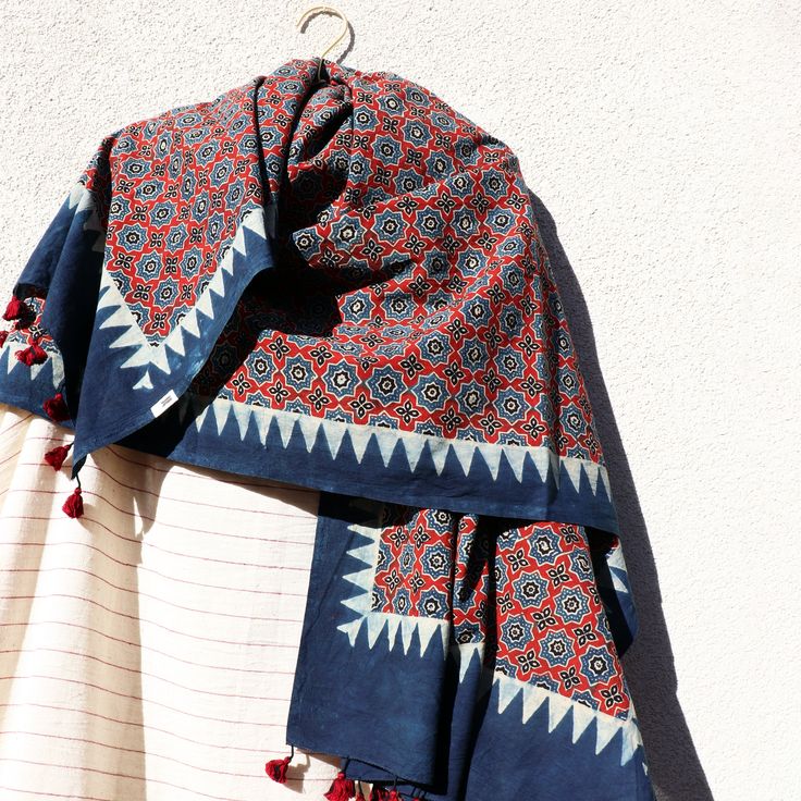 A supremely versatile accessory, wear the dupatta draped around your shoulders, or wrapped around your hip like a sarong, or as a headwrap like a turban. A touch of magic any day. ______ Traditional Ajrakh hand block-printed dupatta scarf from Kutch, Gujarat. 35" x 96" fairtrade organic cotton textile, hand-printed using heritage techniques, native to the Sindh region. 100% chemical-free and biodegradable, block-printed using natural extract dyes such as indigo, madder, jaggery, and iron acetate Luxury Block Print Katan Silk Dupatta, Bohemian Cotton Dupatta For Festive Occasions, Bohemian Dupatta With Bandhani Print, Bohemian Dupatta With Traditional Drape, Bohemian Indigo Cotton Dupatta, Bohemian Cotton Headscarf For Festivals, Festive Bohemian Scarf With Traditional Drape, Bohemian Cotton Dupatta With Motifs, Bohemian Handloom Dupatta With Traditional Drape