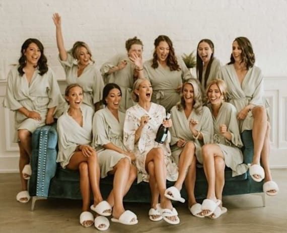 a group of women sitting on top of a couch