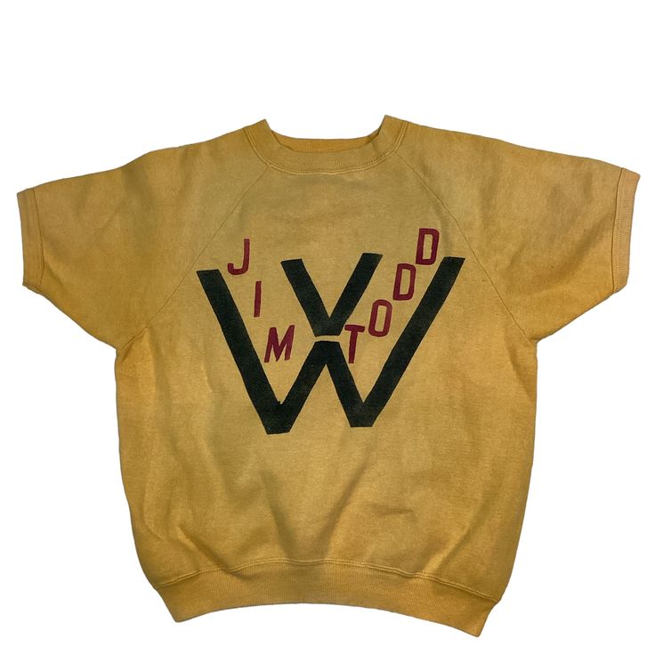 Vintage 1950s/60s Jim Todd ( West Virginia? ) crewneck sweatshirt. High quality. Short sleeve. Tag is missing, measures as a small. 20 inches pit to pit, 22 inches long. Mustard yellow with black and red graphic. No rips or tears, has a couple of faint discoloration flaw as shown in last photo. Rare vintage find. Smoke and pet free home. Vintage Cotton Crew Neck T-shirt, Vintage Cotton Crew T-shirt, Vintage Cotton Sweatshirt With Graphic Print, Retro Cotton Sweatshirt, Retro Crew Neck Sweater With Letter Print, Vintage Crew Sweatshirt, Vintage Cotton Sweatshirt, Retro Crew Cotton Sweater, Retro Cotton Crew Sweater