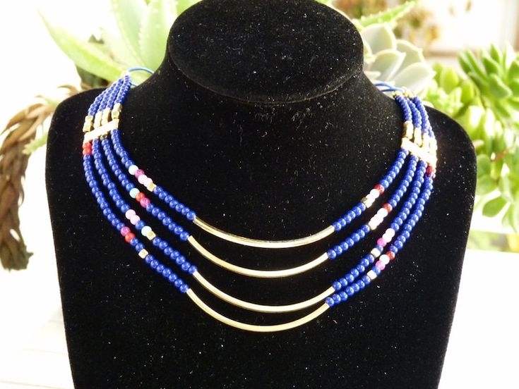 Gold Jewelry With Colorful Beads For Layering, Blue Multi-strand Jewelry For Layering, Adjustable Blue Multi-strand Jewelry, Adjustable Multi-strand Blue Jewelry, Gold Multi-strand Beaded Necklaces, Blue Multi-strand Jewelry With Dangling Beads, Gold Beaded Multi-strand Bib Necklace, Blue Beaded Multi-strand Jewelry, Blue Beaded Multi-strand Layered Necklace