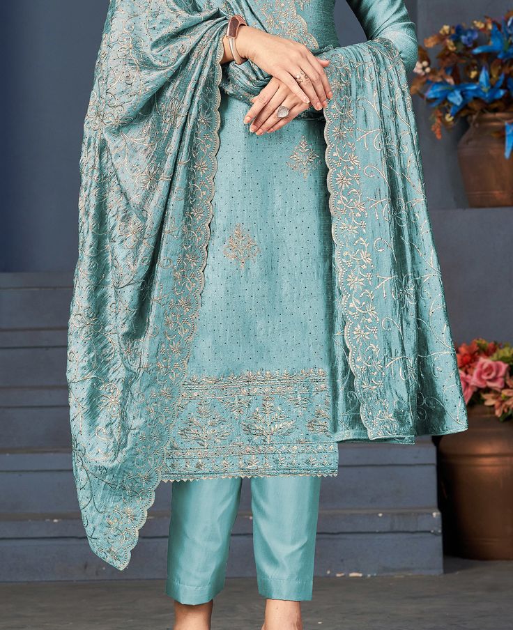 COLOR : Light Blue FABRIC : Top - Blooming Vichitra Silk, Bottom - Dull Santoon, Dupatta - Blooming Vichitra Silk WORK : Resham Embroidery, Zari, Sequins, Stones, Lace BorderOCCASION : Engagement, Party Wear, Festival READY-TO-WEAR : No STITCHING : Available as semi-stitched fabric, can be stitched using standard size option (+$20). Note: There might be a slight color variation due to lighting and flash used during photoshoot. The bright shade seen is the best closer view of fabric's color. Light Blue Party, Silk Pant Suit, Resham Embroidery, Light Blue Fabric, Silk Pant, Holiday Promotions, Blue Party, Pant Suit, Lace Border