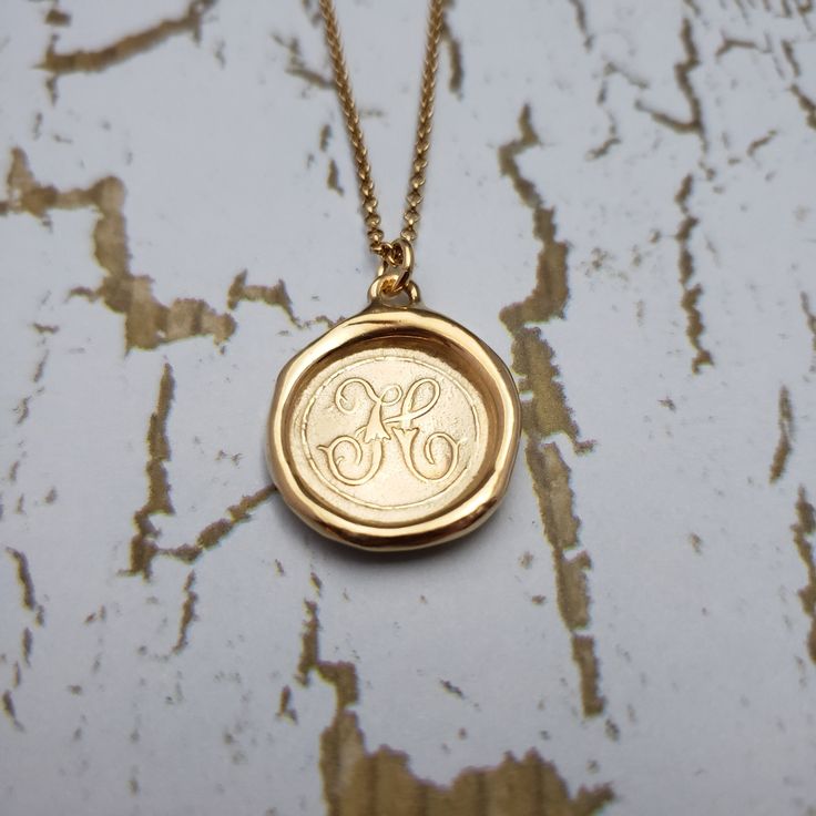 "Monogram Initial letter \"H\" Materials: Silver, Gold, Gold vermeil Gold vermeil is a thick 24k layer of gold over a solid sterling silver base. Size: 3/4\" {21mm} The antique wax seals used to make my initials are mostly around 170 yrs but can be as young as 70 yrs, and as old as 750+ yrs old (My letter i). As each wax seal was individually collected, I am unable to change the font or size. They are only available as shown. PLEASE NOTE: Before you order please check sizing information - it can be hard to gauge jewelry sizes from pictures alone. On some of the seal pieces the text is so small as to be read only with a magnifying glass making the meaning a secret between you and those you choose to tell. Availability and shipping Your purchase will ship in 3-5 business days. Once shipped, Gold Monogram Initial Necklace For Formal Occasions, Gold Monogram Initial Necklace For Formal Events, Classic Stamped Gold Jewelry, Classic Gold Initial Necklace For Formal Occasions, Luxury Personalized Gold Initial Necklace, Gold Engraved Medallion Initial Necklace, Gold Initials Necklace For Formal Occasions, Gold Necklaces With Initials For Formal Occasions, Formal Gold Necklaces With Initials