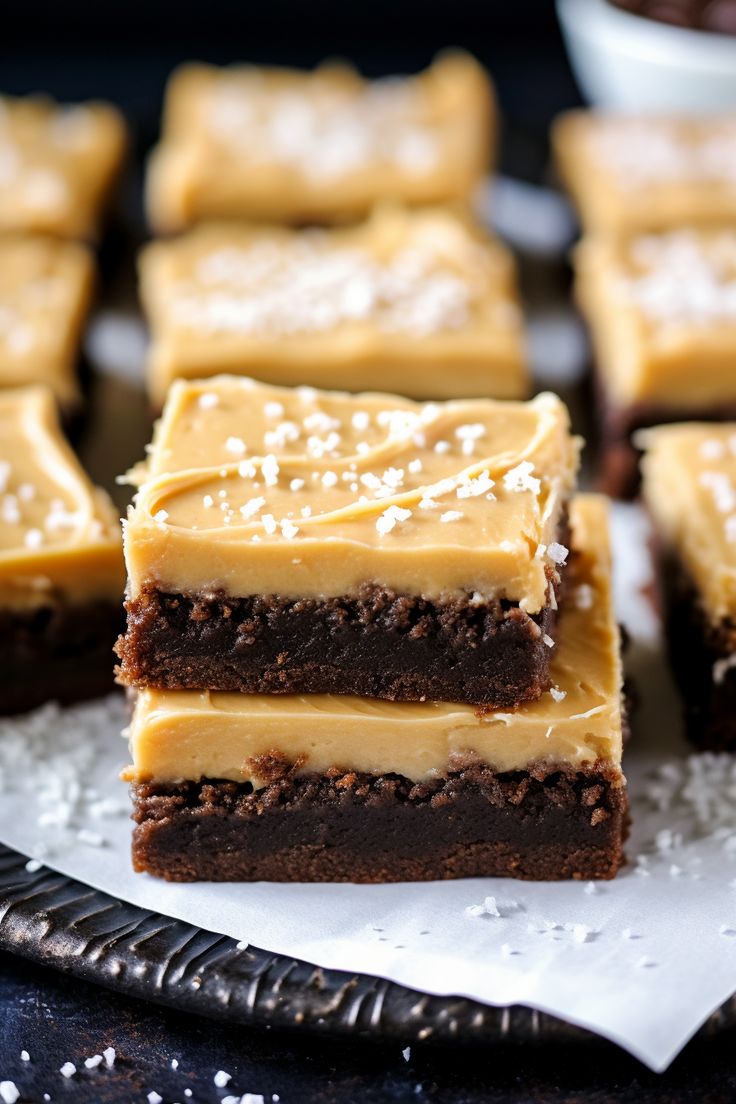 several pieces of brownie with white frosting on top