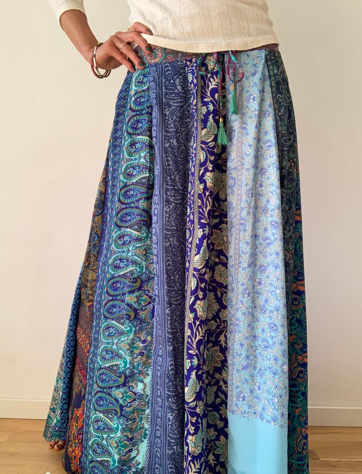 "This gorgeous colourful gypsie skirt is all fun to wear, boho style inspired long and flowy true hippy girl skirt it is made free size and floor length always one of a kind patchwork, made of varieties of different fabrics with floral patterns, very easy to wear and comfy it has elasticated waist band, and will fit most of sizes S-L MEASURE One Size Fits Most length 39\" waist 28\"-34\" CARE * Hand wash recommended * Hang to dry It is perfect outfit for everyday and evenings out or travels and Multicolor Bohemian Maxi Skirt For Festivals, Bohemian Multicolor Maxi Skirt For Festivals, Hippie Style Flowy Maxi Skirt With Boho Print, Bohemian Long Skirt With Boho Print, Hippie Flowy Maxi Skirt With Boho Print, Hippie Long Skirt With Boho Print, Bohemian Flared Maxi Skirt With Floral Print, Hippie Boho Print Flowy Maxi Skirt, Hippie Style Long Boho Print Skirt